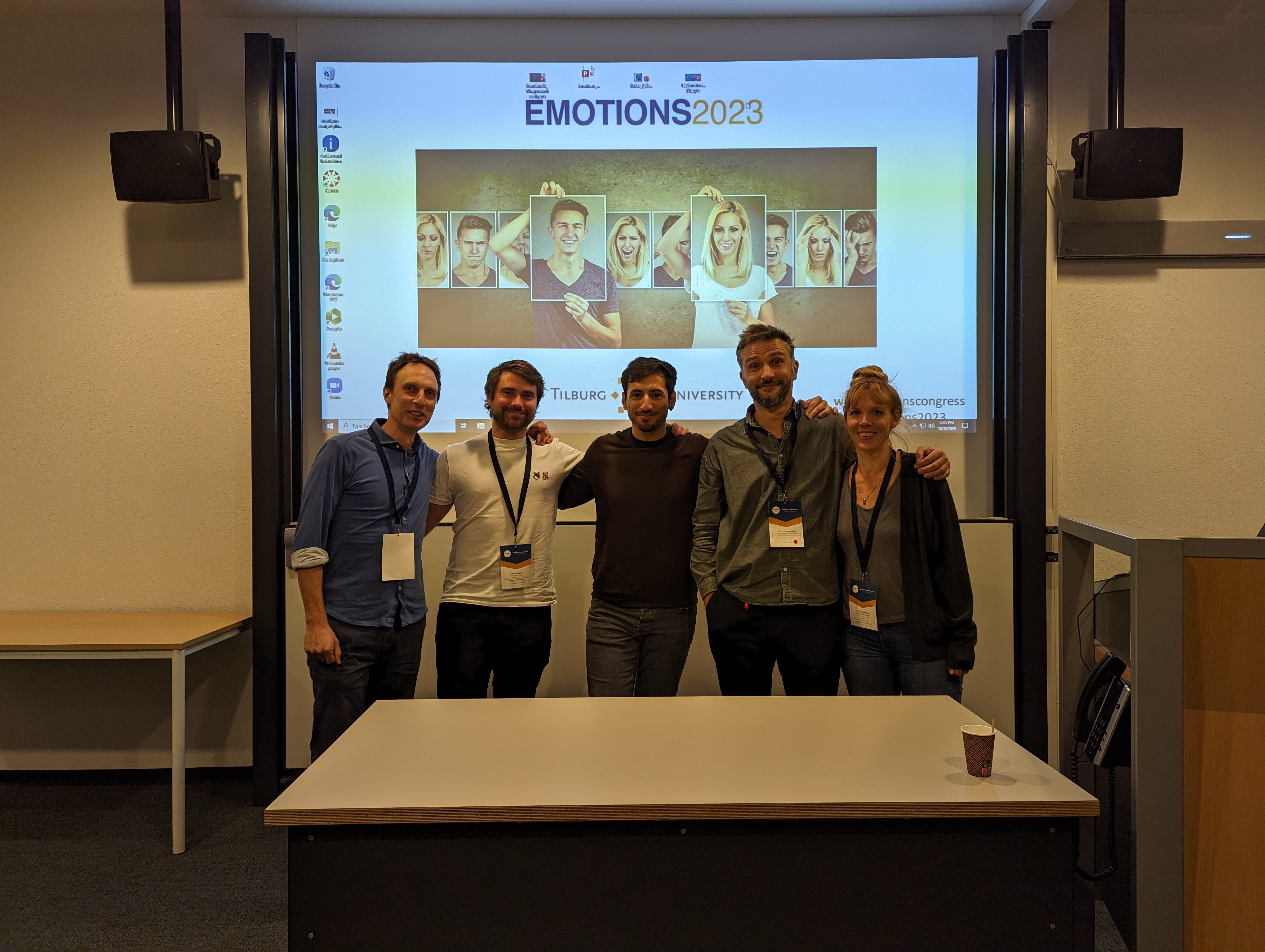 Group photo from the Emotions Symposium in a conference setting, featuring Dr Sebastian Korb, Dr Joshua Baker, Dr Tanja Wingenbach, and Dr Michal Olszanowski.